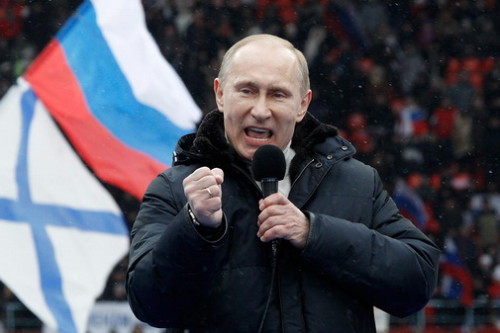 Presidential candidate and Russia's current Prime Minister Putin delivers a speech during a rally to support his candidature in the upcoming presidential election at the Luzhniki stadium on the Defender of the Fatherland Day in Moscow